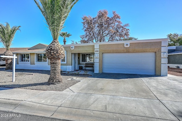 ranch-style house featuring a garage