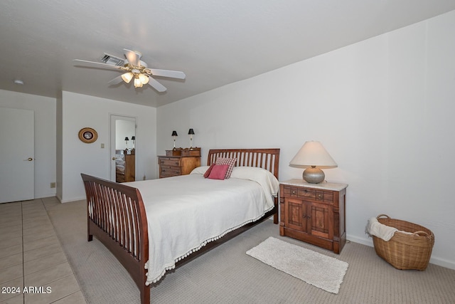 tiled bedroom with ceiling fan