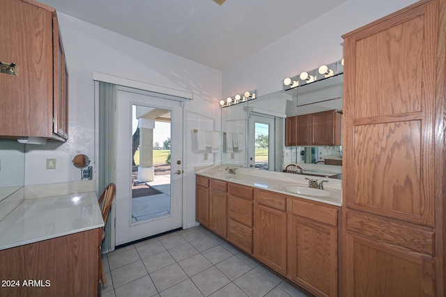 bathroom featuring vanity, tile patterned floors, and lofted ceiling