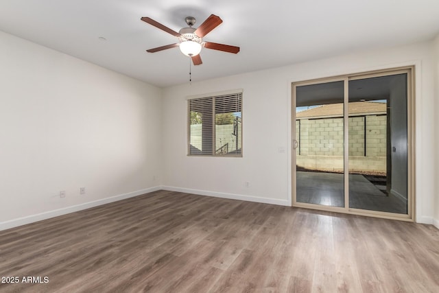 spare room featuring ceiling fan and hardwood / wood-style floors