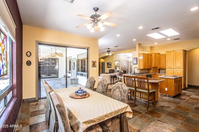 6334 E Albany St, Mesa, AZ 85205 - dining room featuring a ceiling fan, stone tile flooring, baseboards, and recessed lighting