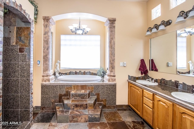 6334 E Albany St, Mesa, AZ 85205 - full bathroom with stone tile flooring, a bath, a chandelier, and double vanity