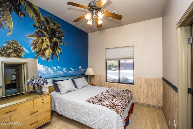 6334 E Albany St, Mesa, AZ 85205 - carpeted bedroom featuring a wainscoted wall, wood walls, and a ceiling fan