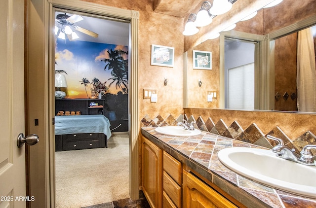 6334 E Albany St, Mesa, AZ 85205 - ensuite bathroom featuring double vanity, ceiling fan, and decorative backsplash