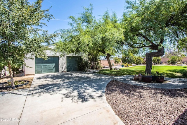 6334 E Albany St, Mesa, AZ 85205 - obstructed view of property featuring a garage, a front yard, and concrete driveway