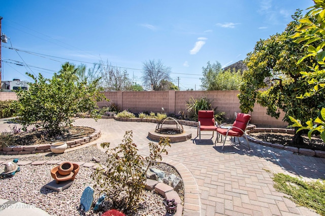 6334 E Albany St, Mesa, AZ 85205 - fenced backyard featuring an outdoor fire pit and a patio area