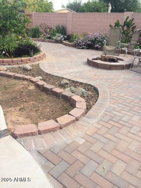 6334 E Albany St, Mesa, AZ 85205 - view of yard featuring a patio and an outdoor fire pit
