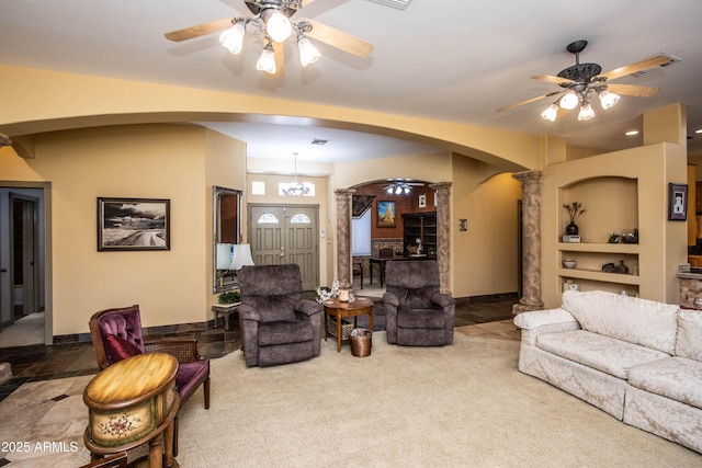6334 E Albany St, Mesa, AZ 85205 - carpeted living area with arched walkways, a ceiling fan, decorative columns, built in features, and baseboards