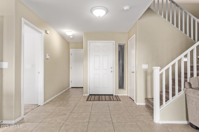 entrance foyer featuring light tile patterned floors