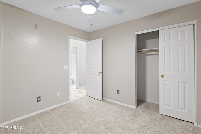 unfurnished bedroom with a closet, ceiling fan, carpet, and baseboards