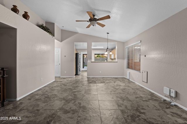unfurnished living room featuring baseboards, a ceiling fan, and lofted ceiling