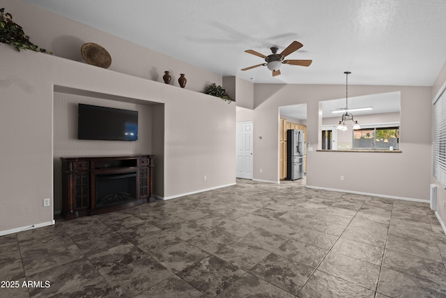 unfurnished living room featuring a fireplace, ceiling fan, vaulted ceiling, and baseboards
