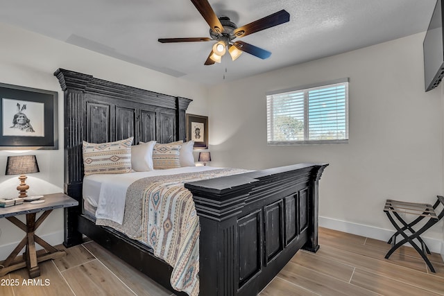 1209 E Marigold Ln, Tempe, AZ 85288 - bedroom featuring light wood-style flooring, baseboards, and a ceiling fan