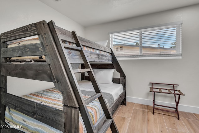 1209 E Marigold Ln, Tempe, AZ 85288 - bedroom with baseboards and wood finished floors
