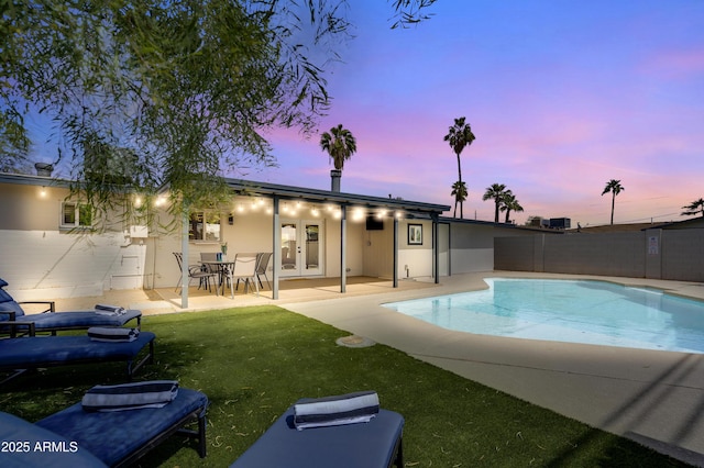 1209 E Marigold Ln, Tempe, AZ 85288 - pool at dusk with french doors and a patio