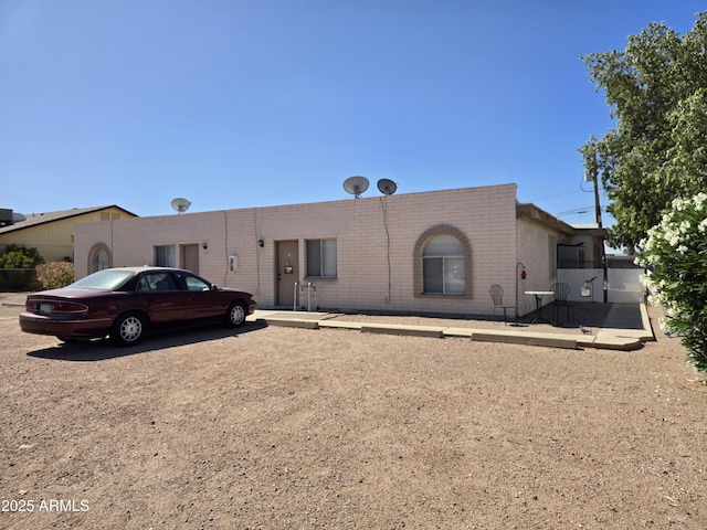 501 E Kachina Ave, Apache Junction, AZ 85119 - back of property featuring brick siding and uncovered parking