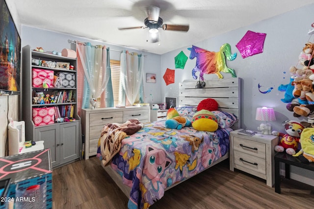 bedroom with ceiling fan and dark hardwood / wood-style flooring