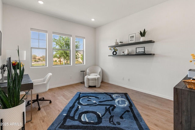 office space with recessed lighting, baseboards, and wood finished floors