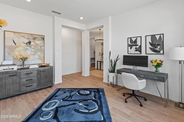 office space featuring recessed lighting, baseboards, light wood-type flooring, and visible vents