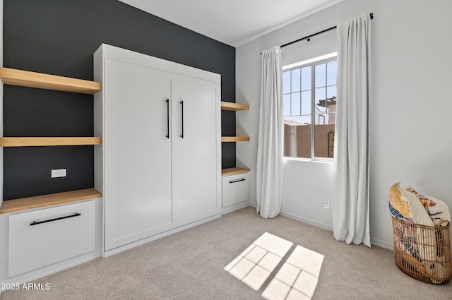 bedroom featuring light colored carpet