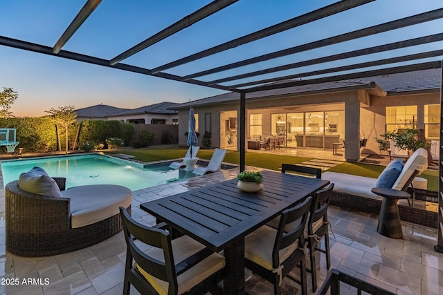 pool at dusk featuring a fenced in pool, a pergola, a patio, and outdoor dining space