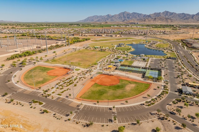 bird's eye view with a water and mountain view