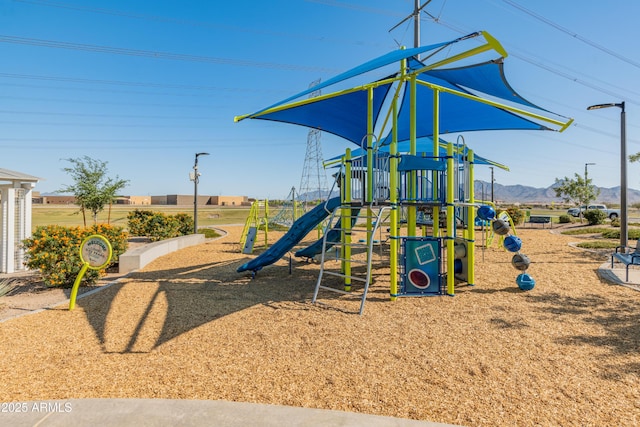 community play area featuring a mountain view
