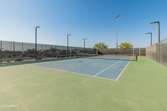 view of sport court with fence