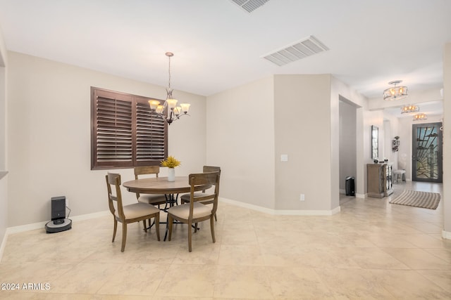 dining room featuring a notable chandelier