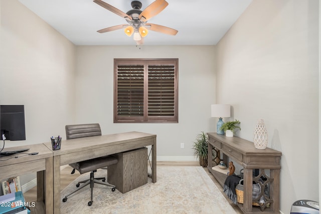 office space featuring light hardwood / wood-style flooring and ceiling fan