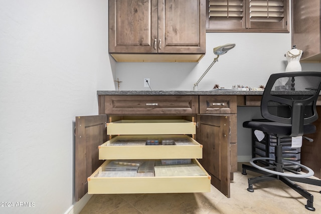 interior space featuring tile patterned floors and dark brown cabinetry