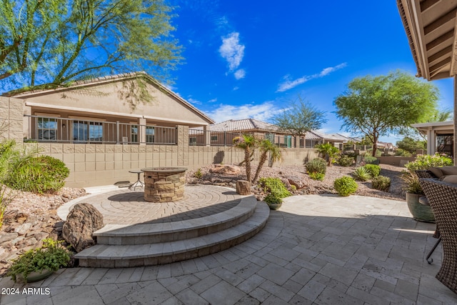 view of patio with an outdoor fire pit