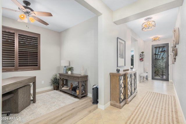 foyer entrance with light wood-type flooring and ceiling fan