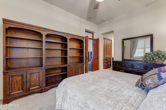 bedroom featuring light carpet and ceiling fan