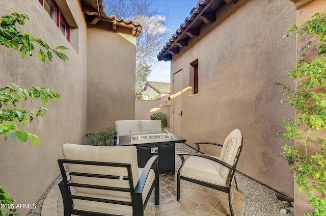 view of patio featuring a fire pit