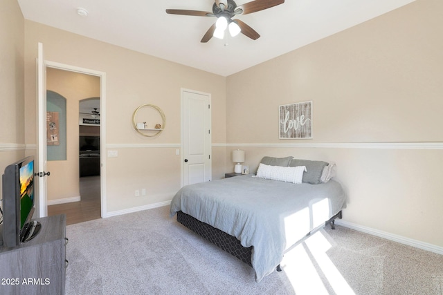 bedroom with light carpet and ceiling fan