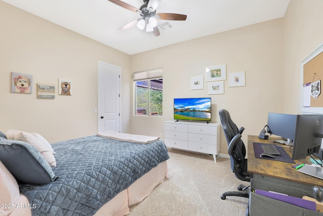 bedroom with ceiling fan and light carpet