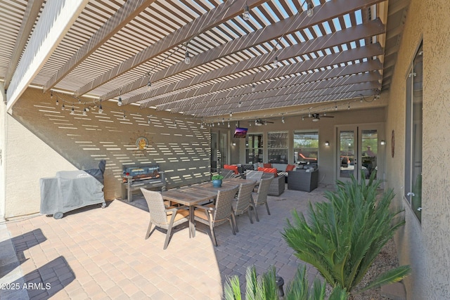 view of patio featuring an outdoor living space, a pergola, and ceiling fan