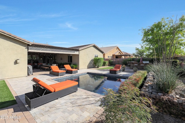 view of pool featuring a patio