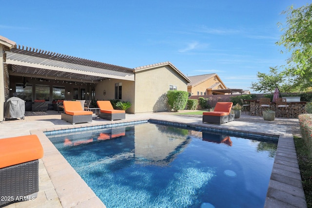 view of swimming pool with a patio