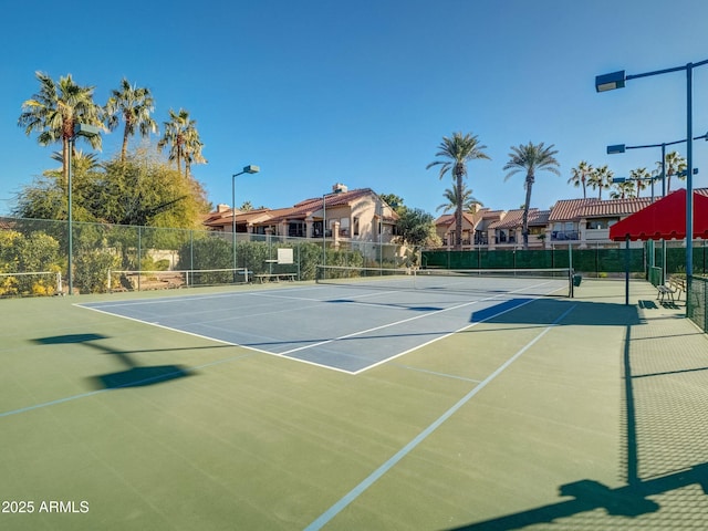 view of tennis court featuring basketball court