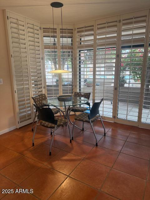 unfurnished dining area with tile patterned flooring