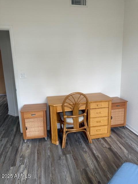 home office with dark hardwood / wood-style floors