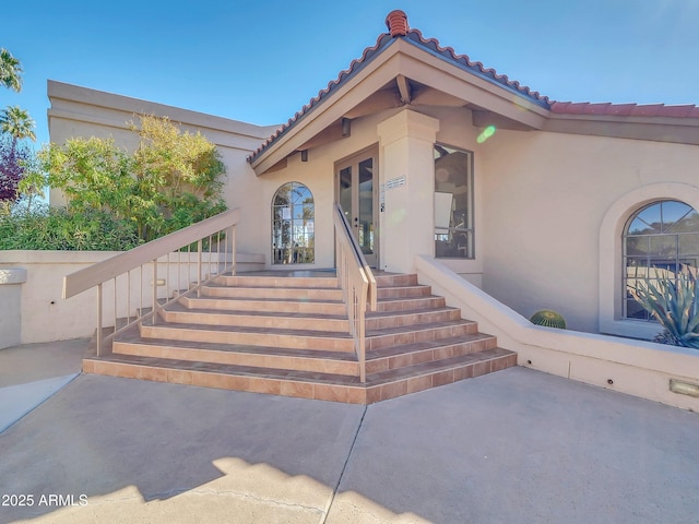 doorway to property with a patio