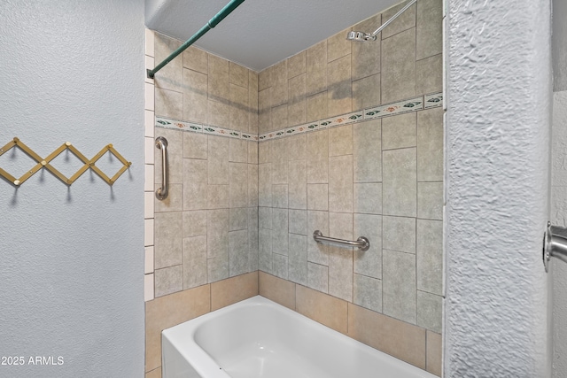 bathroom featuring a textured wall