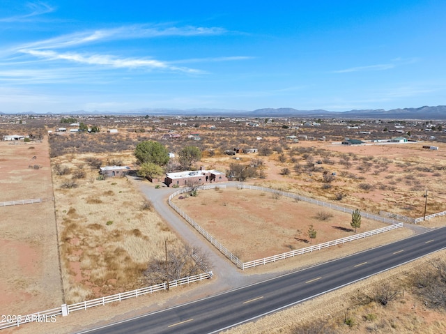 birds eye view of property featuring a mountain view and a rural view