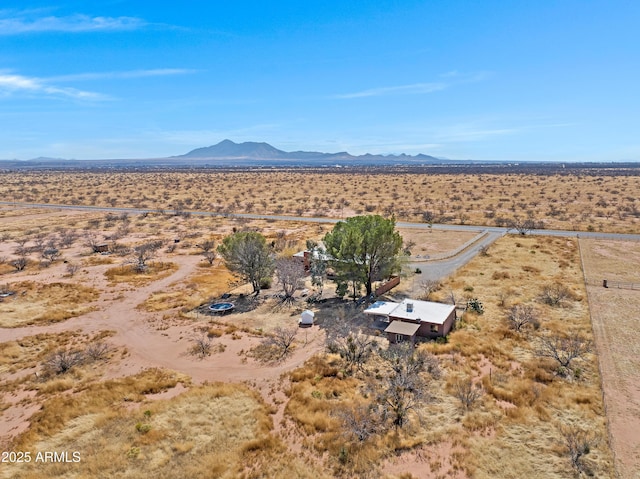 aerial view featuring a rural view, a desert view, and a mountain view