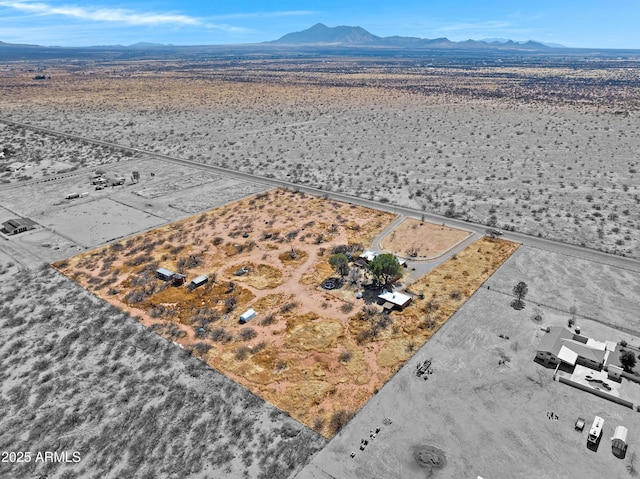 bird's eye view with a mountain view and view of desert