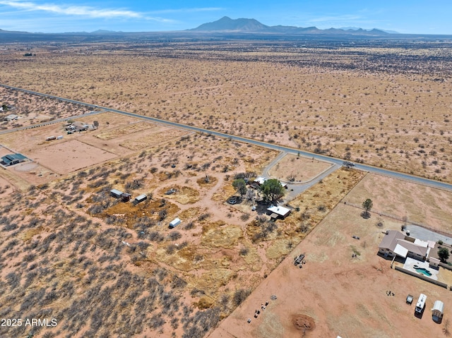 birds eye view of property with a desert view and a mountain view