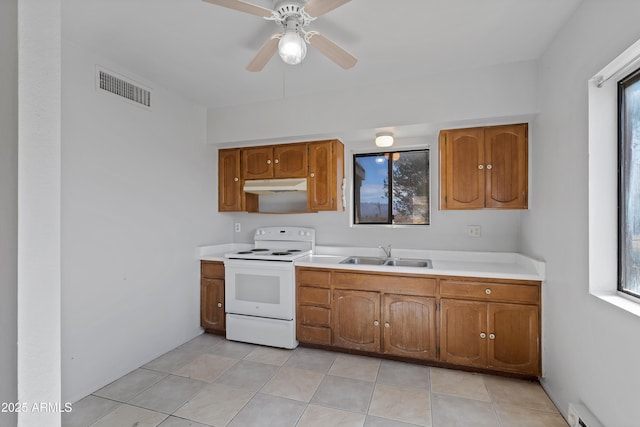 kitchen with under cabinet range hood, a baseboard heating unit, electric range, a sink, and visible vents